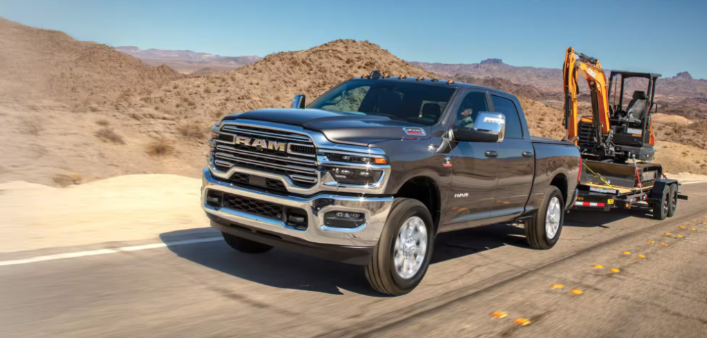 2026 Ram 2500 towing equipment trailer on desert road