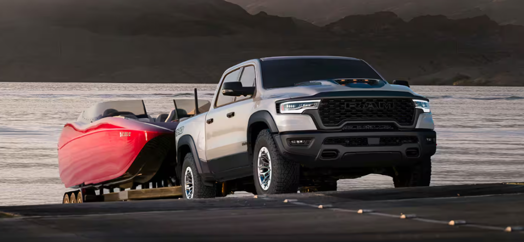 RAM 1500 RHO towing a boat near water