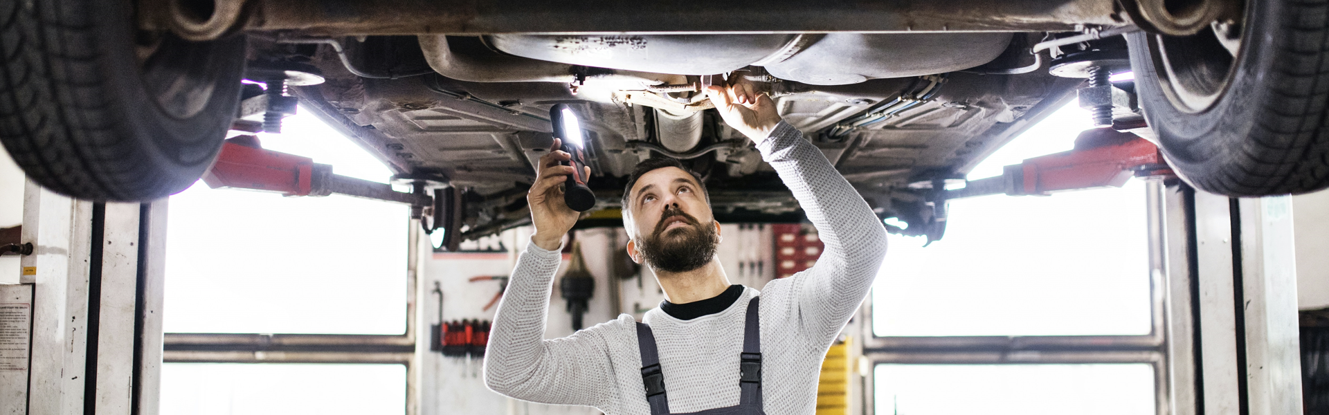 technician checking under the vehicle